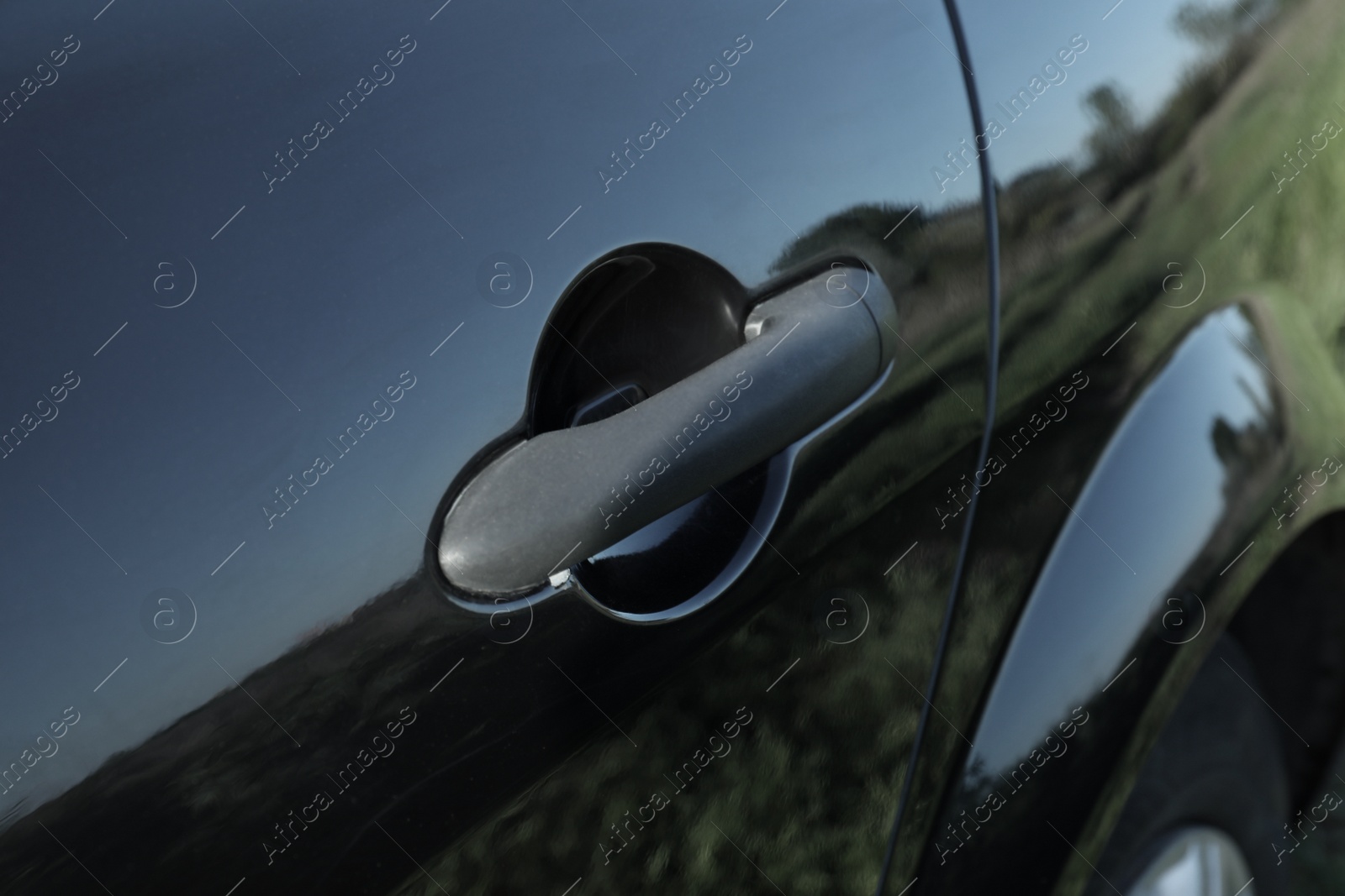 Photo of Car with door handle outdoors, closeup view