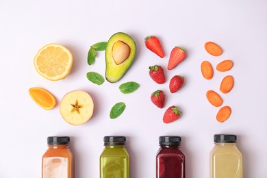 Photo of Flat lay composition with healthy detox smoothies and ingredients on light background