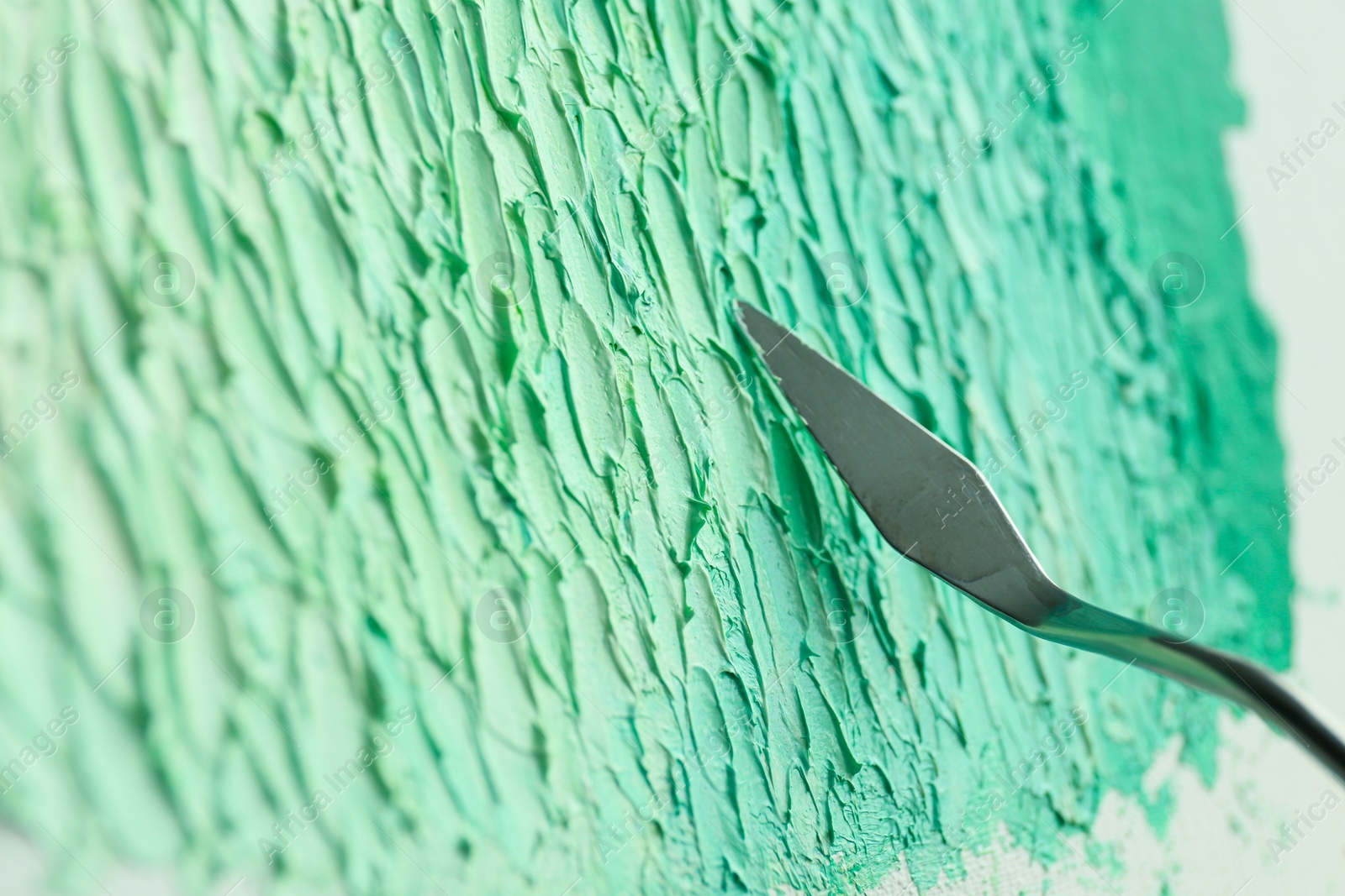 Photo of Abstract colorful artwork painting with spatula, closeup view