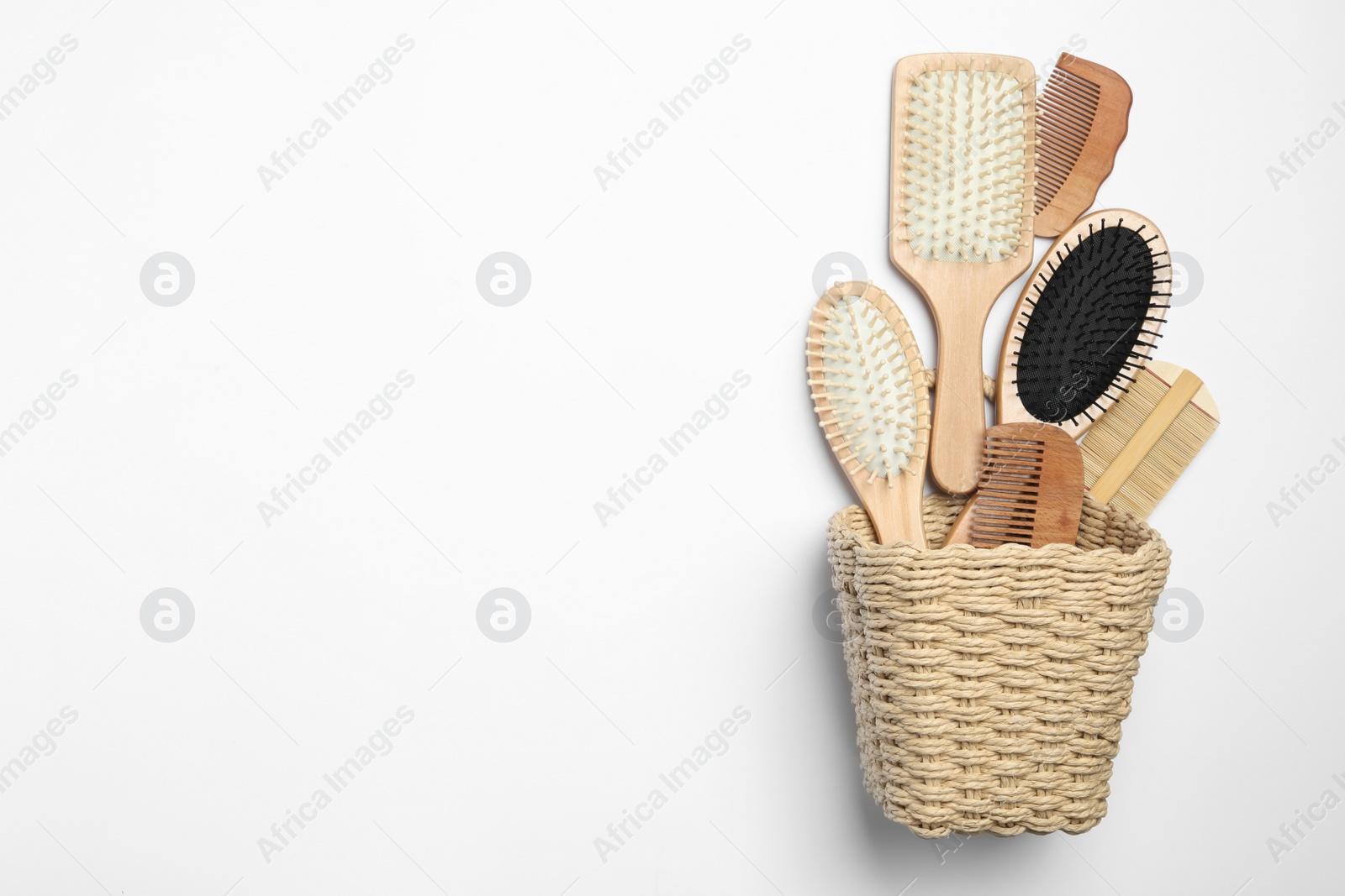 Photo of Composition with hair combs and brushes on white background, top view