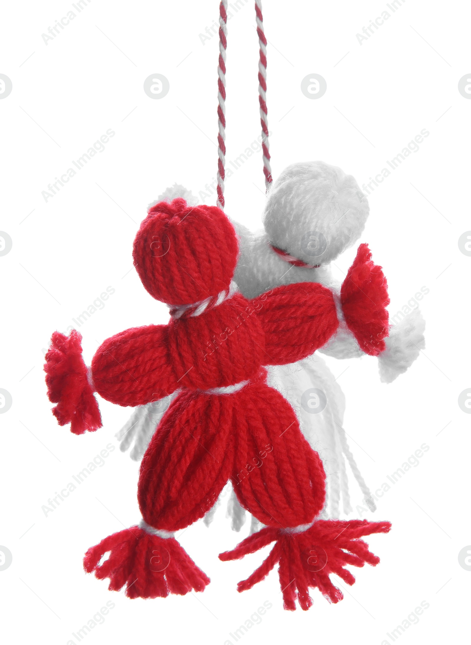 Photo of Traditional martisor shaped as man and woman on white background. Beginning of spring celebration