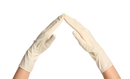 Doctor in medical gloves showing gesture on white background