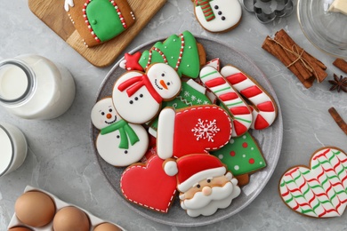 Flat lay composition with delicious homemade Christmas cookies on grey marble table