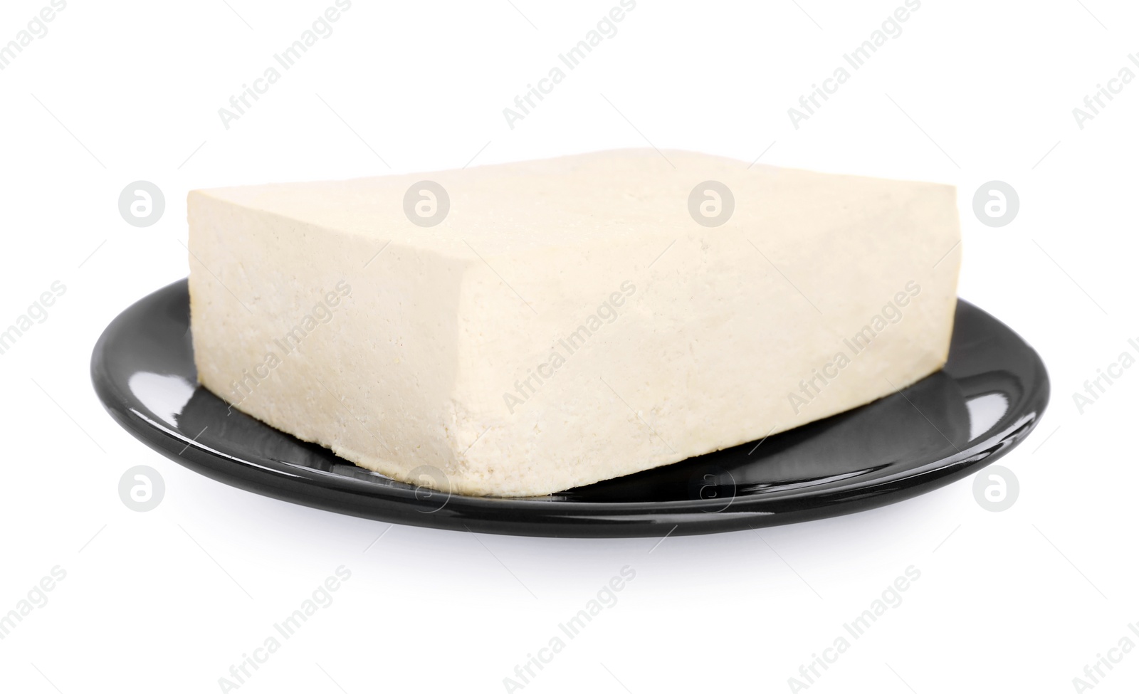 Photo of Plate with delicious raw tofu isolated on white