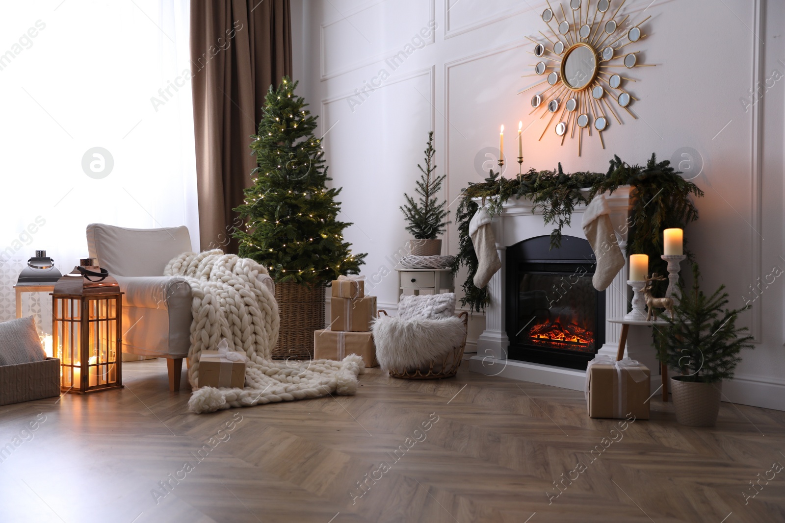 Photo of Stylish room interior with fireplace and beautiful Christmas tree