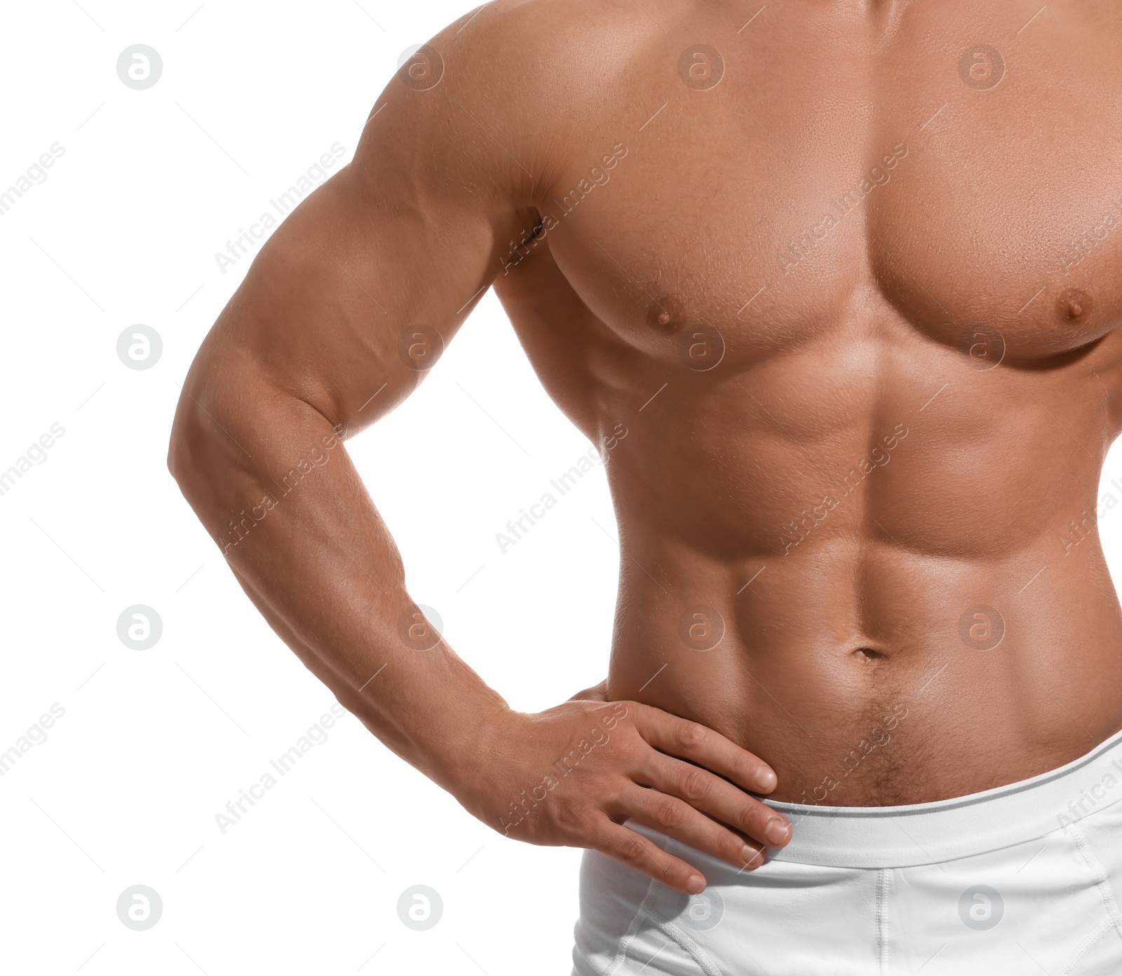 Photo of Muscular man showing abs isolated on white, closeup. Sexy body