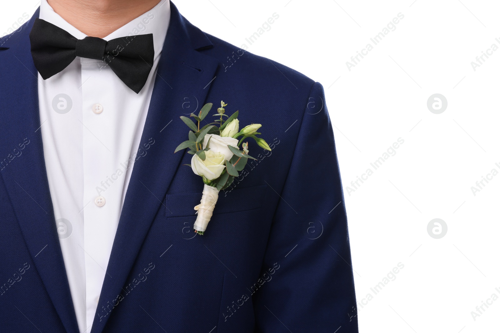 Photo of Groom with boutonniere on white background, closeup. Wedding accessory