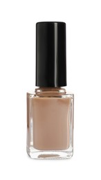 Photo of Beige nail polish in bottle isolated on white