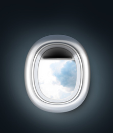 Image of View on cloudy sky through open airplane porthole