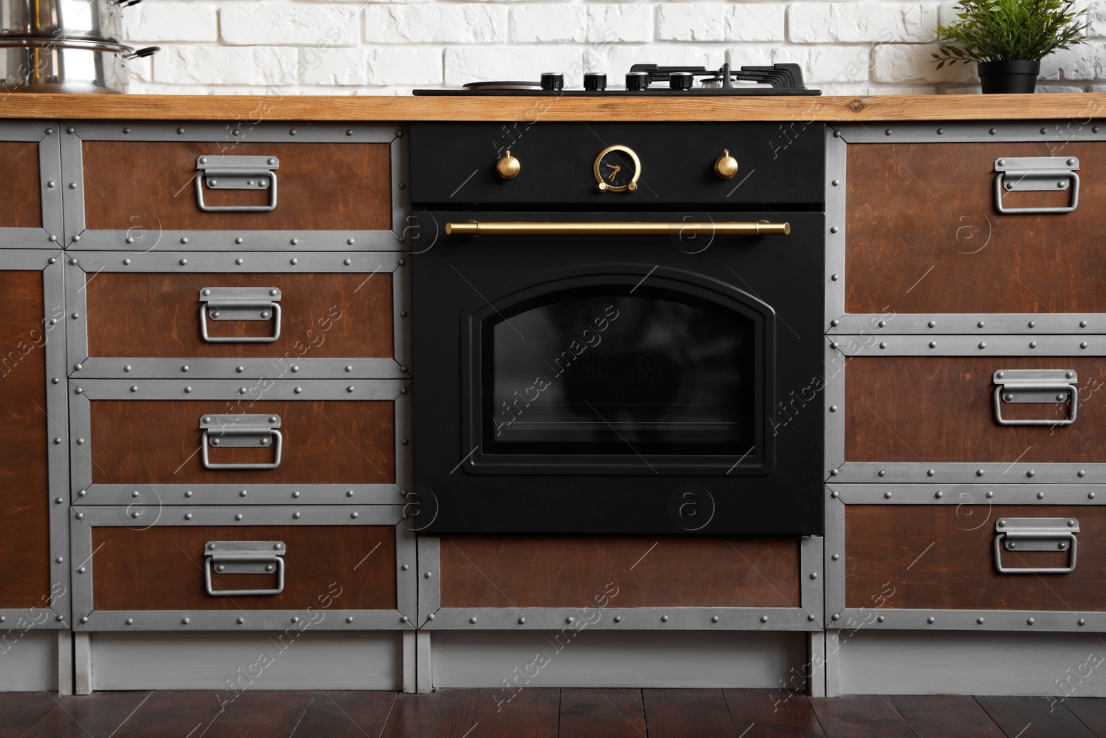 Photo of New modern oven in stylish kitchen. Cooking appliance