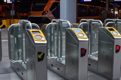 Many modern turnstiles on station. Fare collection system