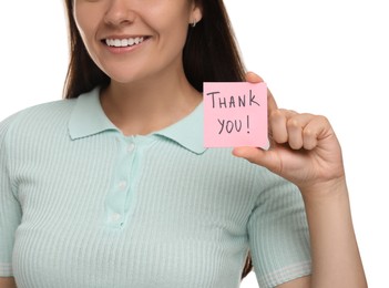 Photo of Woman holding paper note with phrase Thank You on white background, closeup
