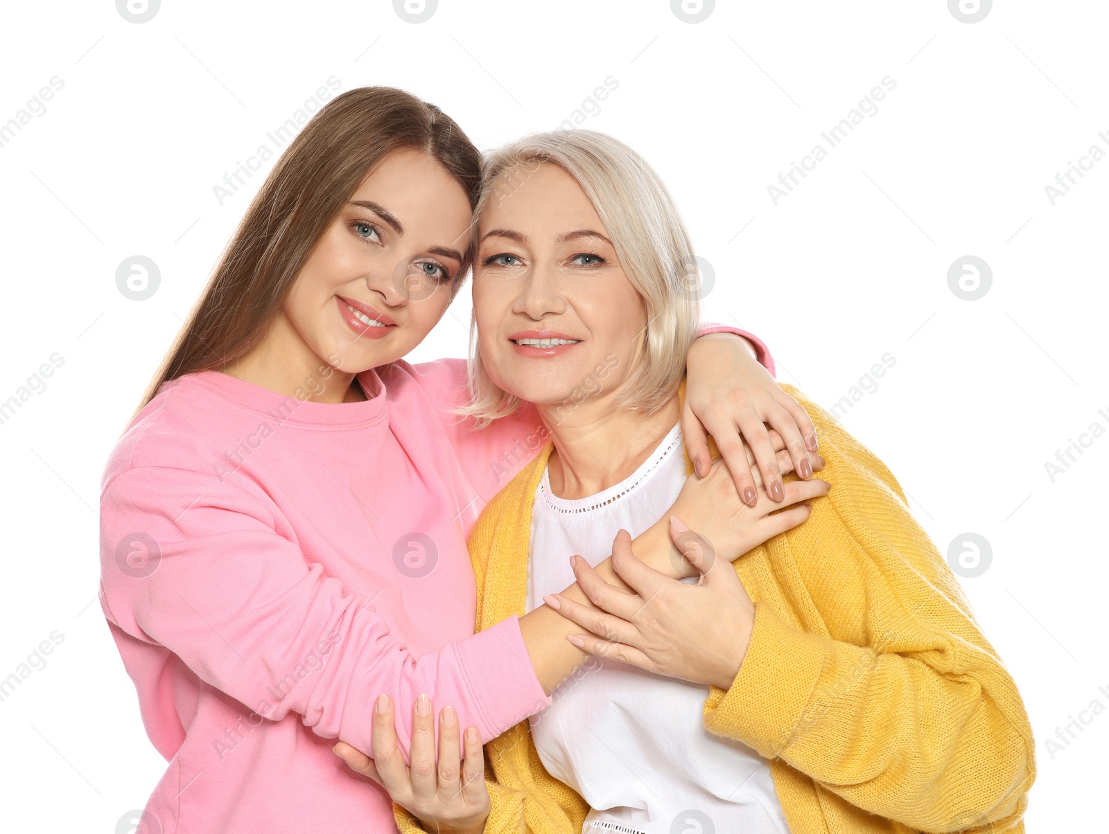 Photo of Portrait of mature woman and her daughter isolated on white