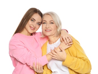 Portrait of mature woman and her daughter isolated on white