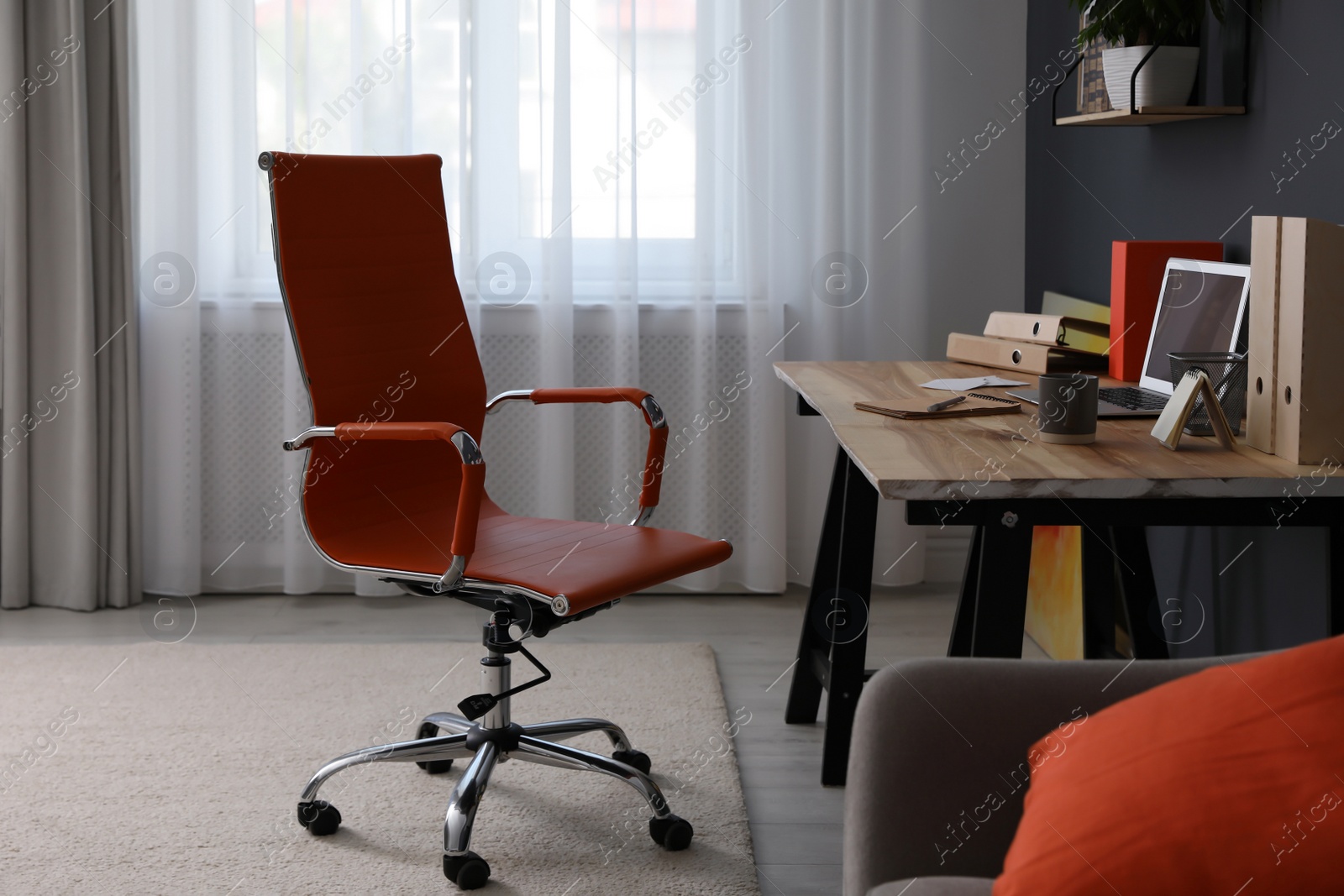 Photo of Modern workplace with comfortable chair in stylish home office interior