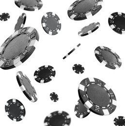 Image of Black casino chips falling on white background
