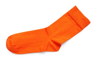 Photo of New orange sock isolated on white, top view. Footwear accessory