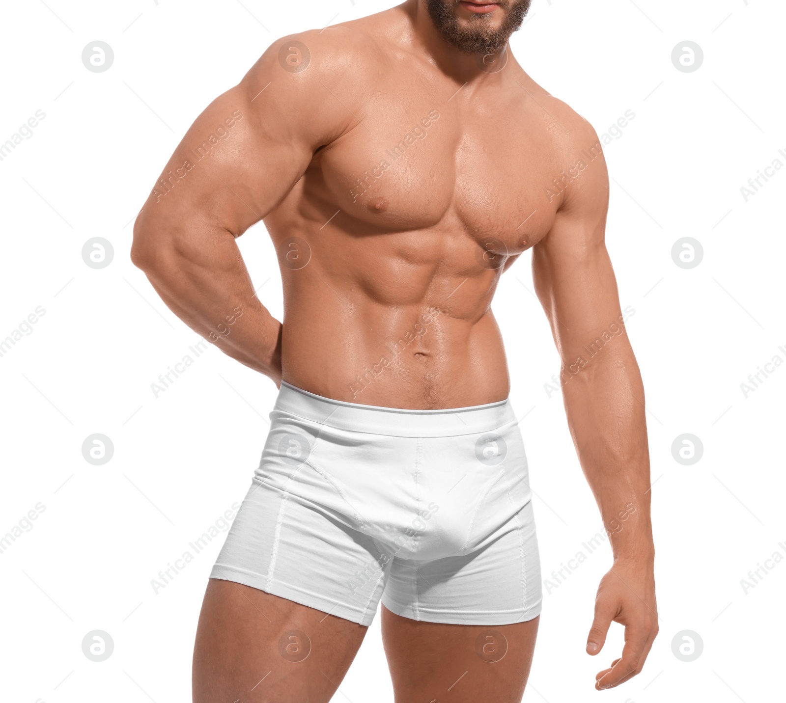 Photo of Muscular man showing abs isolated on white, closeup. Sexy body