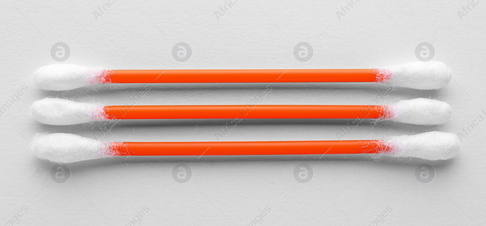 Photo of Clean cotton buds on white background, top view. Hygienic accessory