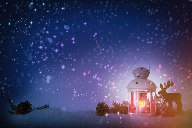 Image of Composition with Christmas lantern on snow, space for text. Magical atmosphere 