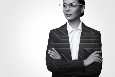 Double exposure of young businesswoman and maze on white background