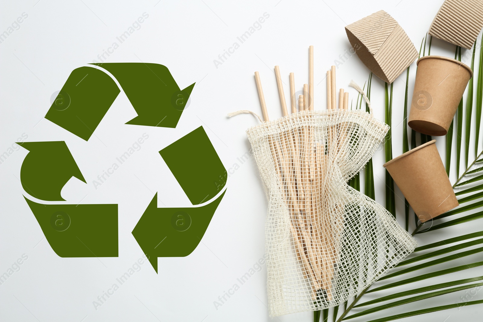 Image of Eco friendly products and recycling symbol on white background, flat lay