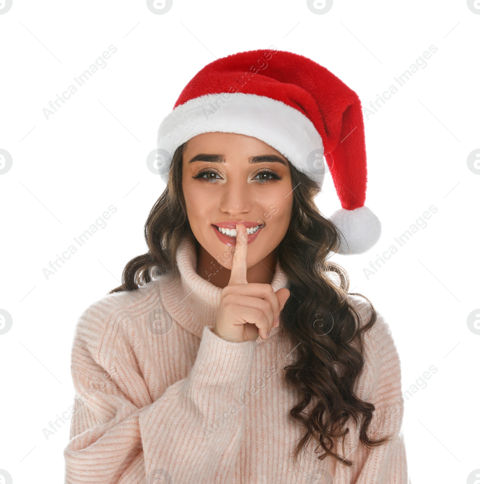 Photo of Beautiful young woman wearing warm sweater and Santa hat on white background. Christmas party