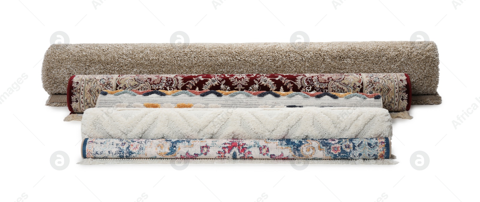 Photo of Rolled carpets on white background. Interior element