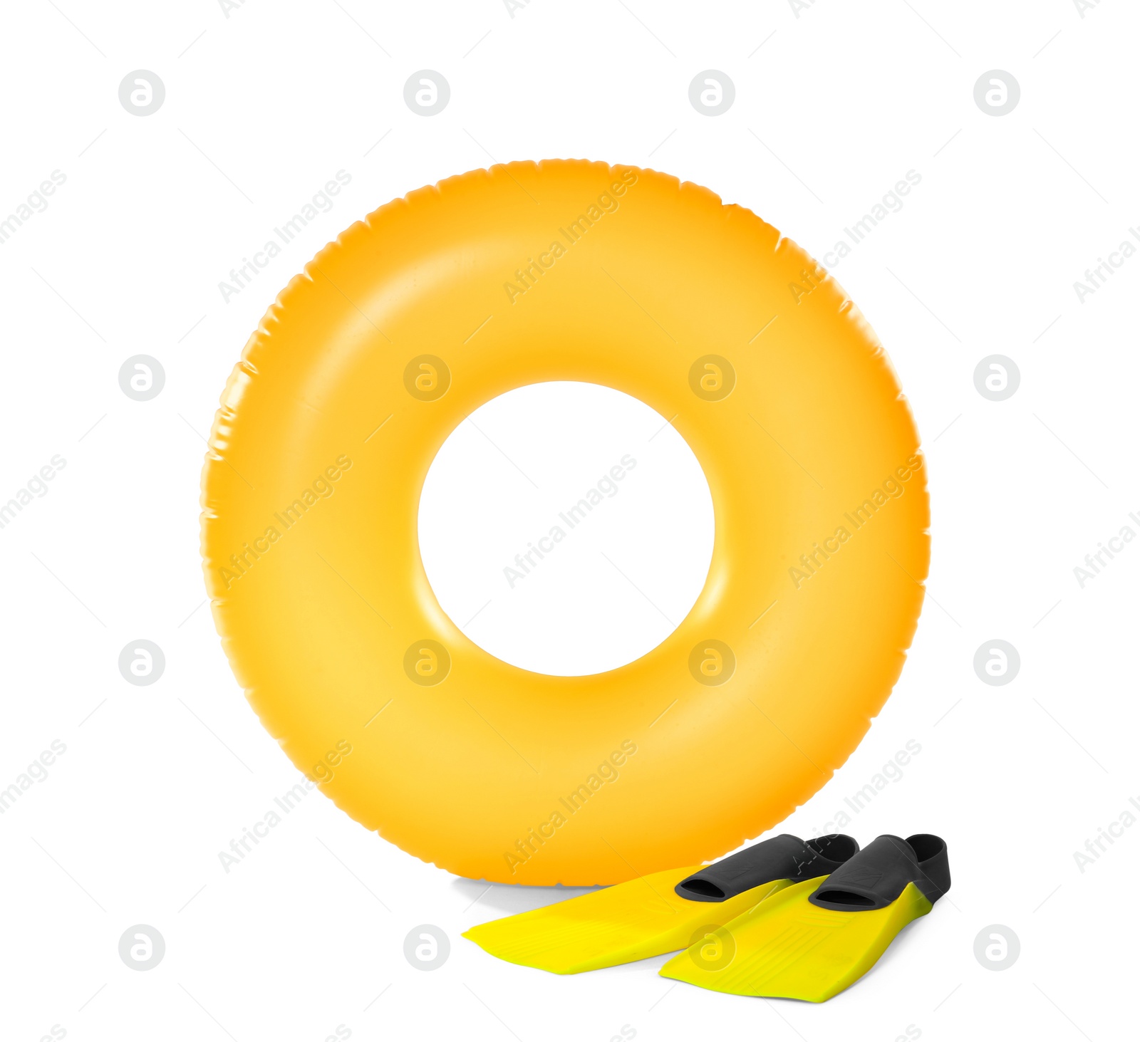 Photo of Inflatable ring and flippers on white background. Summer holidays