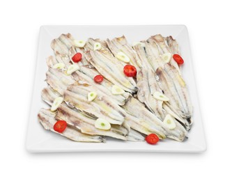 Photo of Tasty pickled anchovies with garlic and chili pepper isolated on white