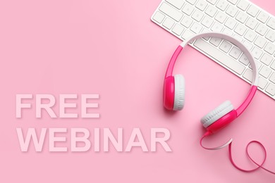 FREE WEBINAR. Modern headphones and keyboard on pink background, flat lay