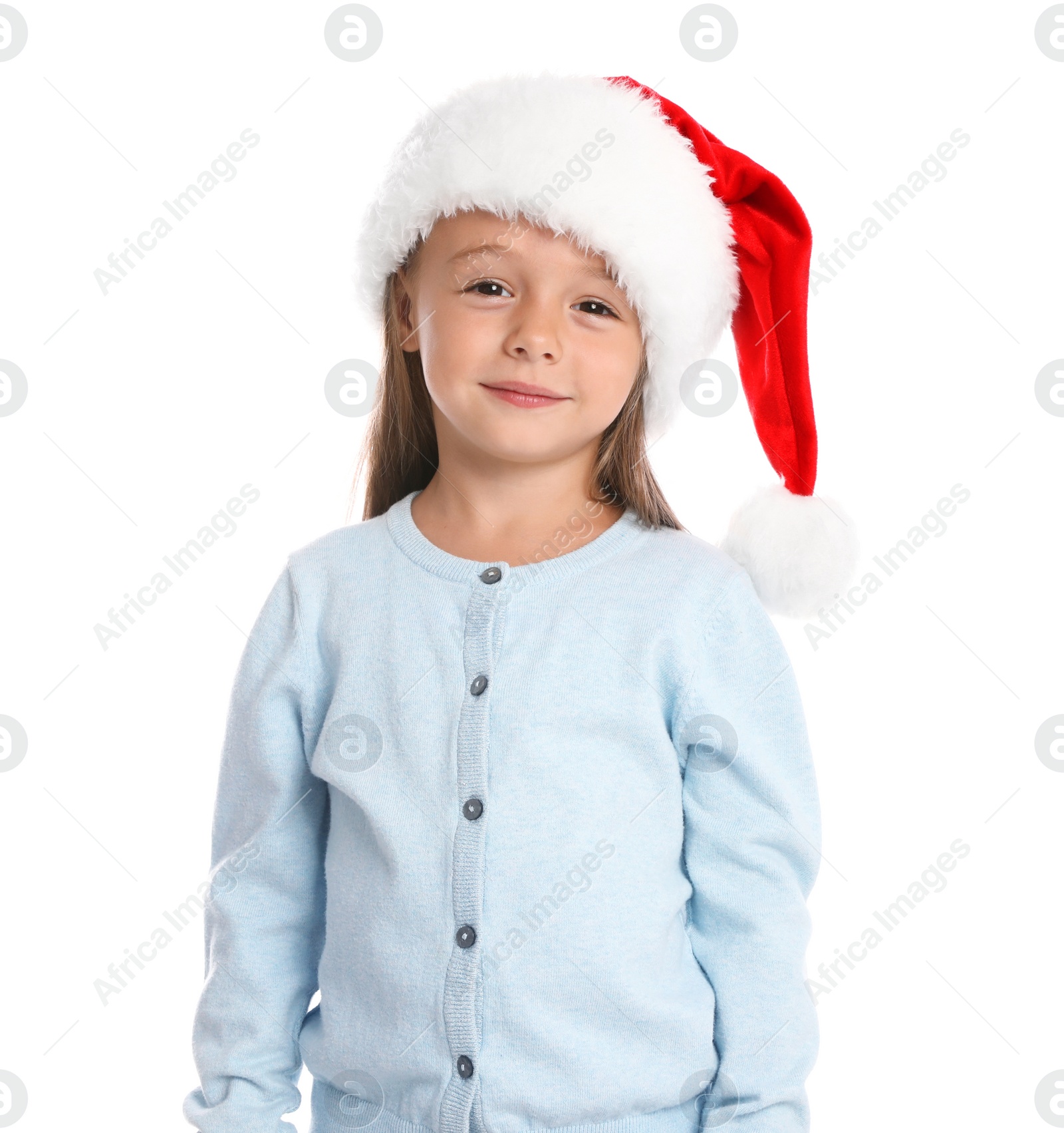 Photo of Happy little child in Santa hat on white background. Christmas celebration