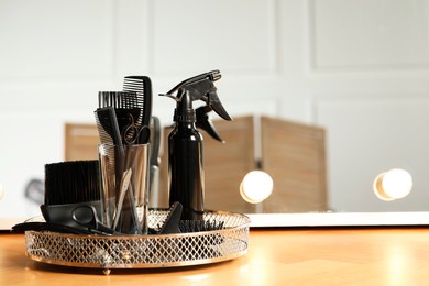 Set of hairdresser tools on table in salon. Space for text