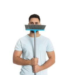 Photo of Young man with broom on white background