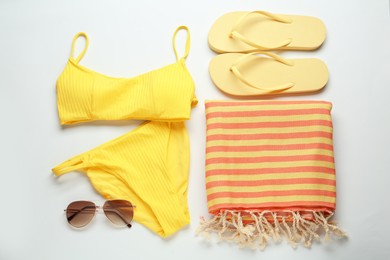 Photo of Flat lay composition with different beach objects on white background