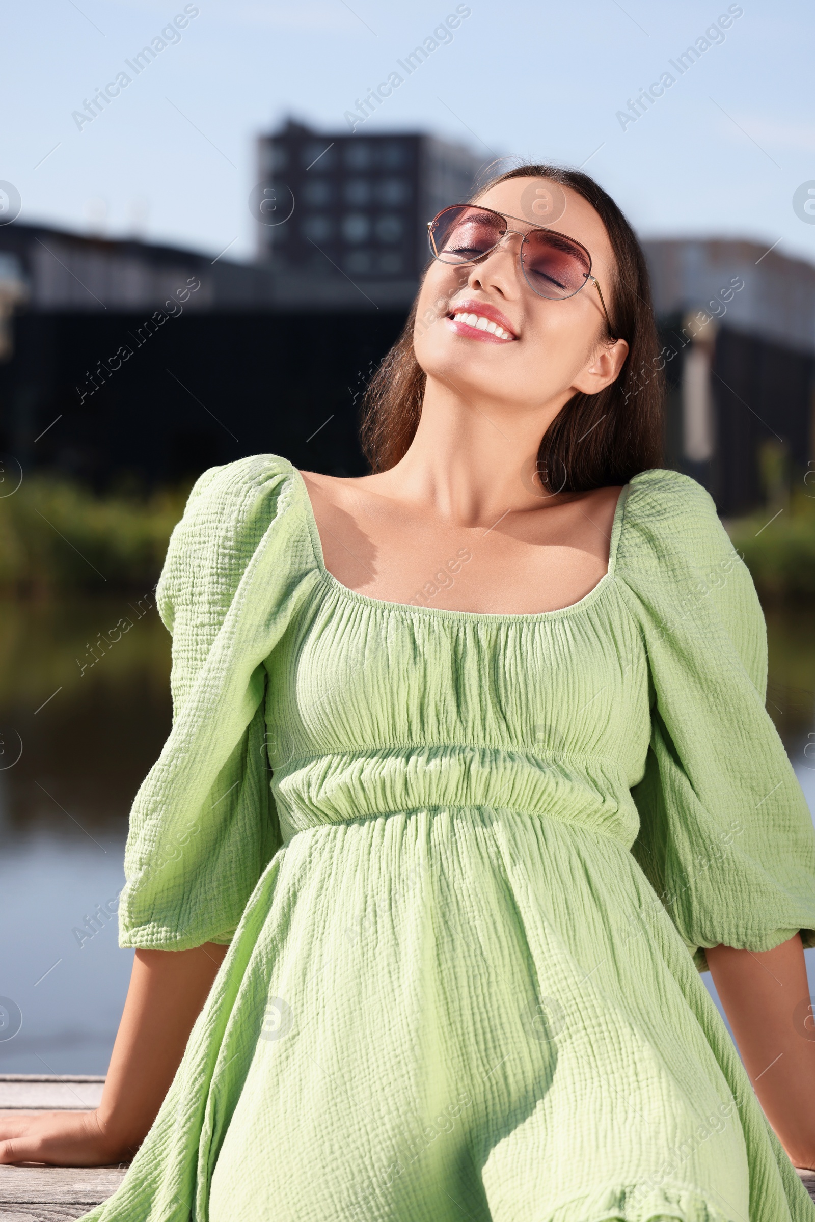 Photo of Beautiful woman in sunglasses outdoors on sunny day