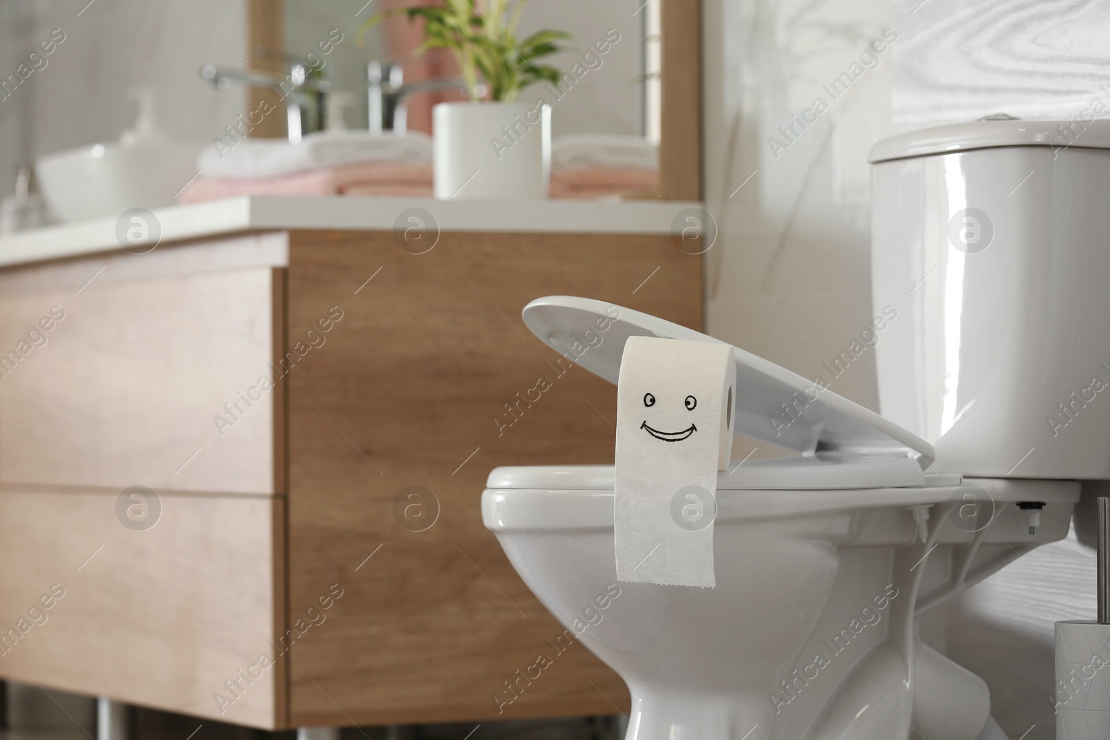 Photo of Interior of modern bathroom with toilet bowl