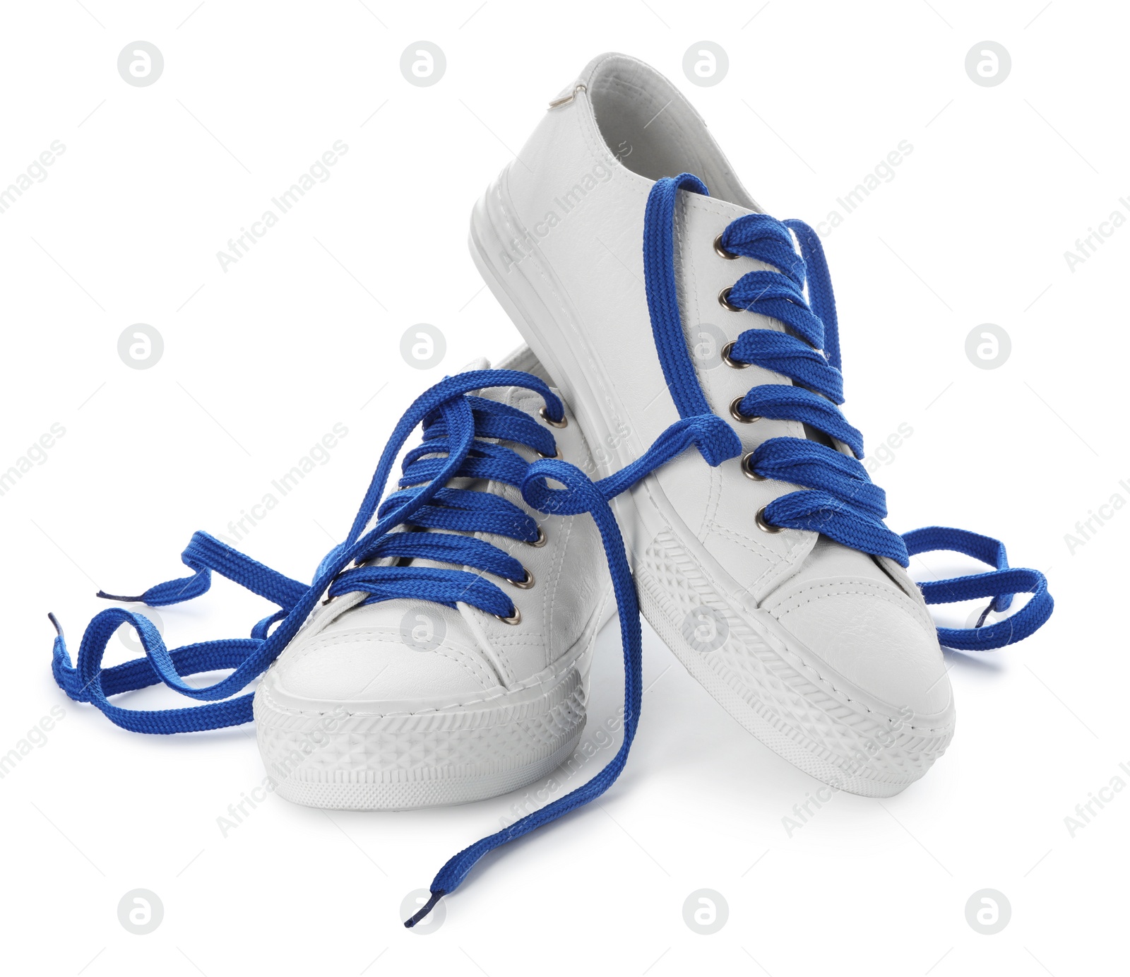 Photo of Stylish sneakers with blue shoelaces on white background
