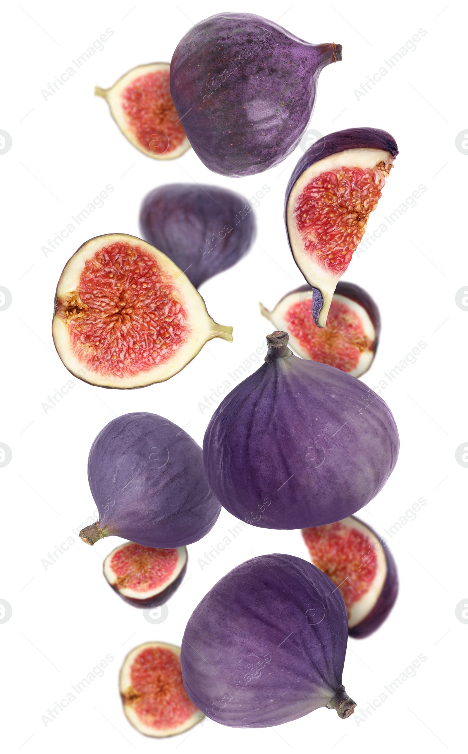 Image of Tasty ripe whole and cut figs flying on white background