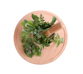 Photo of Wooden board and mortar with different herbs, flowers and pestle on white background, top view