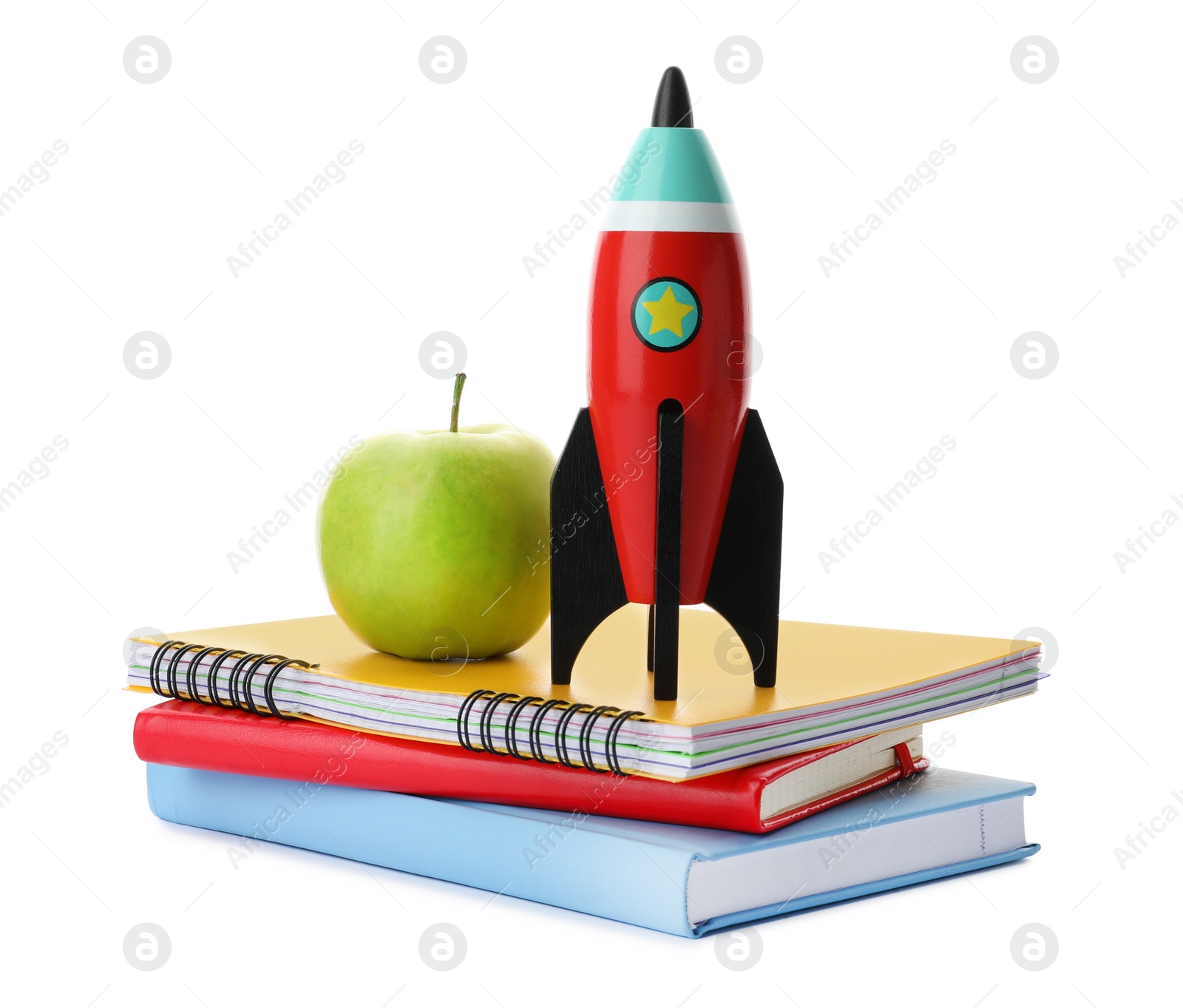 Photo of Bright toy rocket and school supplies on white background