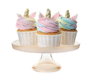 Dessert stand with cute sweet unicorn cupcakes on white background