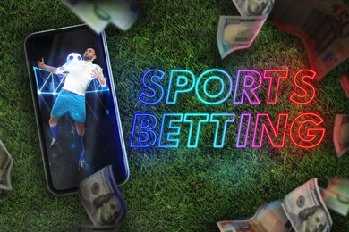 Image of Bookmaking, sports betting. Mobile phone with football player on screen, dollars falling on green grass