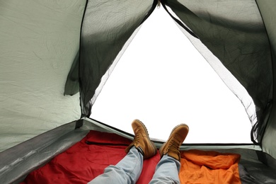 Photo of Closeup of man in camping tent on white background, view from inside