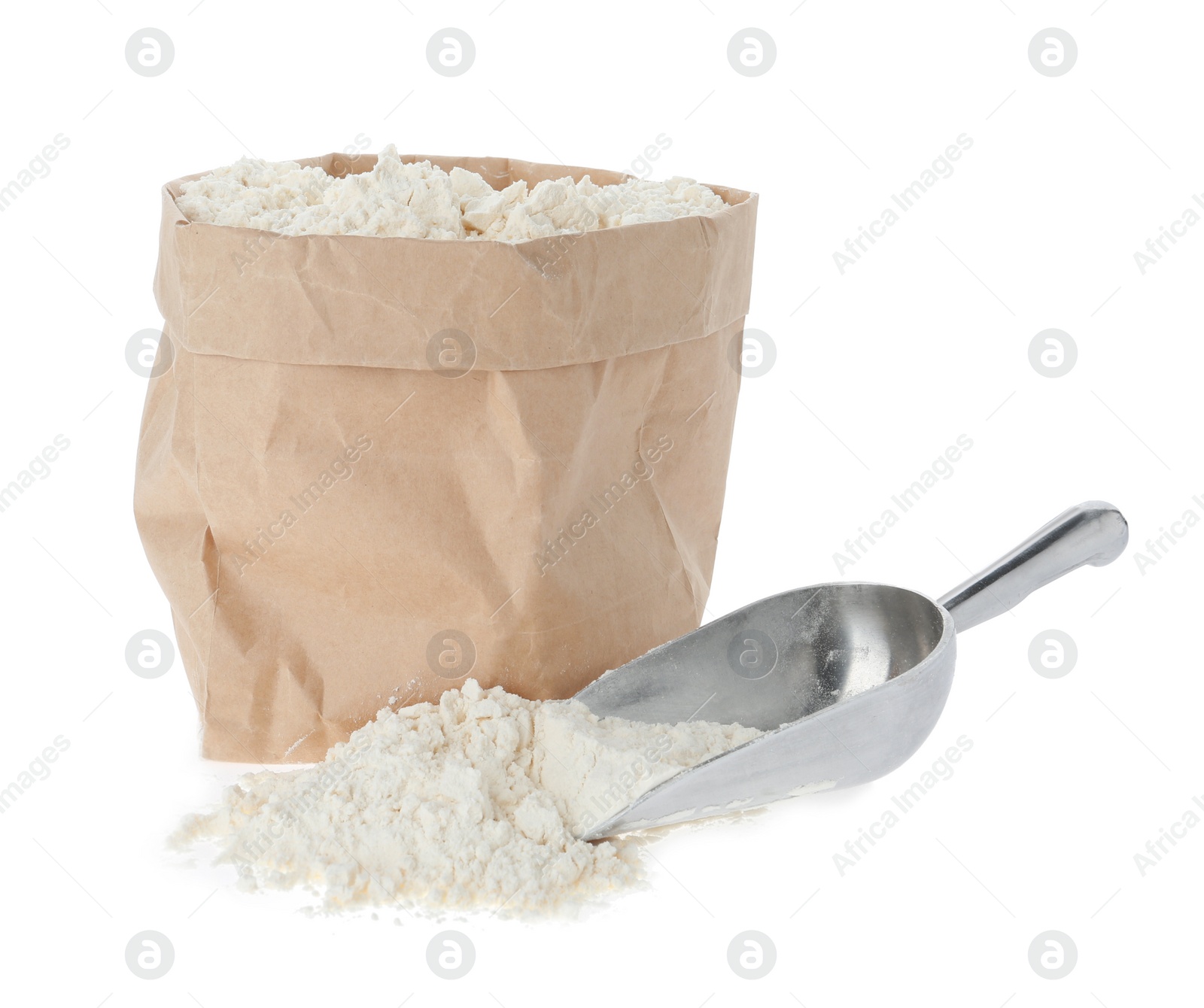 Photo of Paper bag and scoop with flour isolated on white