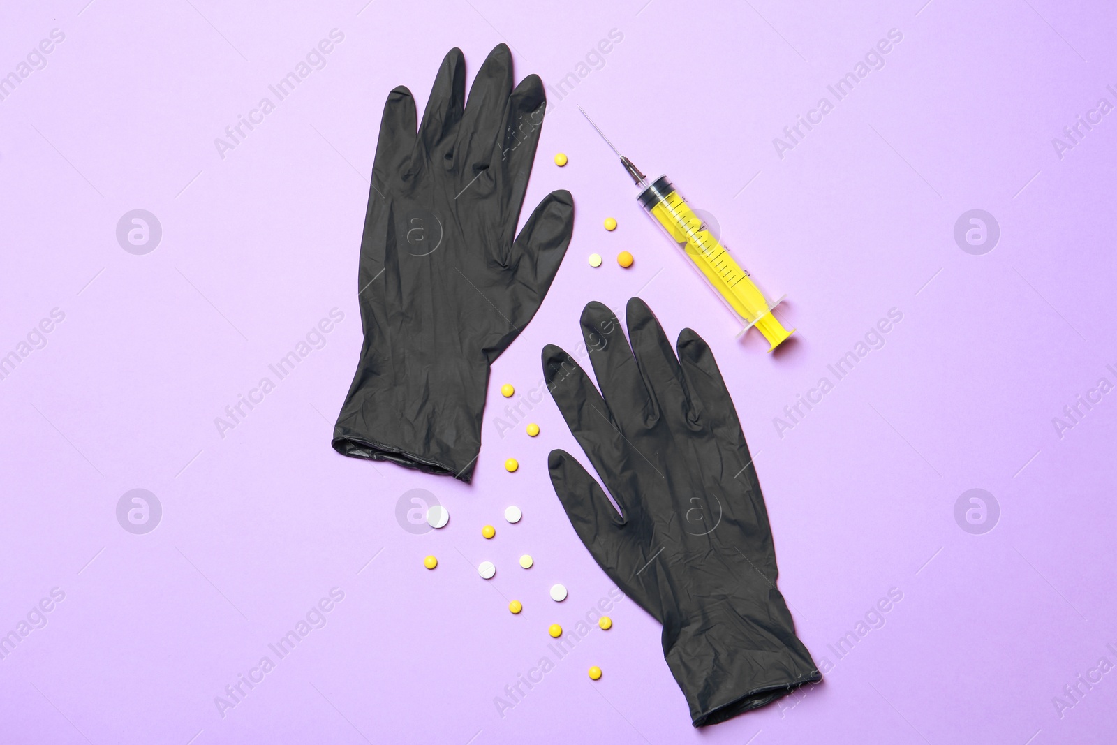 Photo of Flat lay composition with medical gloves on color background