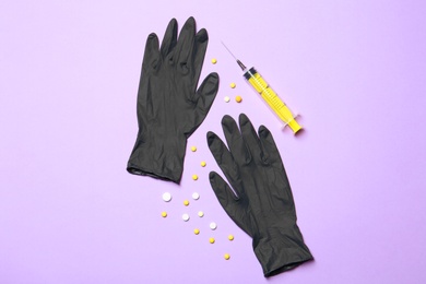 Flat lay composition with medical gloves on color background