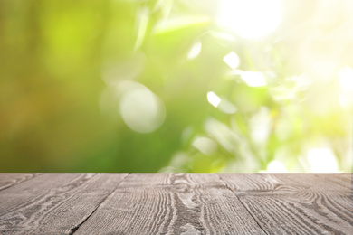 Empty wooden surface against blurred background. Bokeh effect