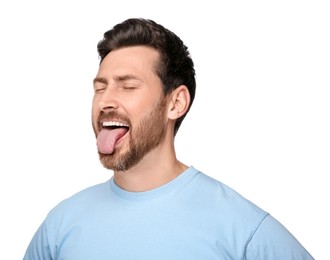 Photo of Man showing his tongue on white background