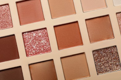 Photo of Beautiful eye shadow palette as background, top view